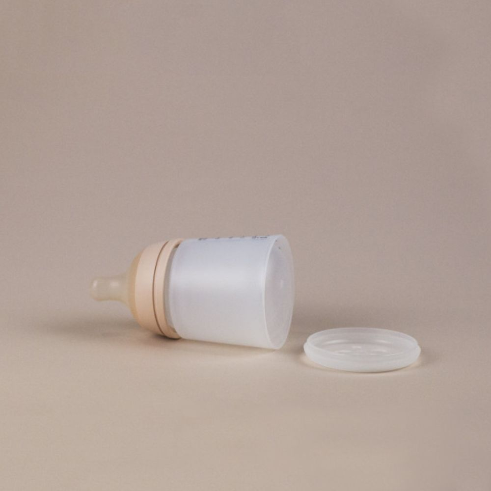 SUAVINEX Zero Zero antikolikinis buteliukas su reguliuojamos srovės žinduku, 180 ml, Light